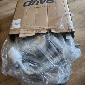 An unused and still unassembled heavy duty commode.⁹